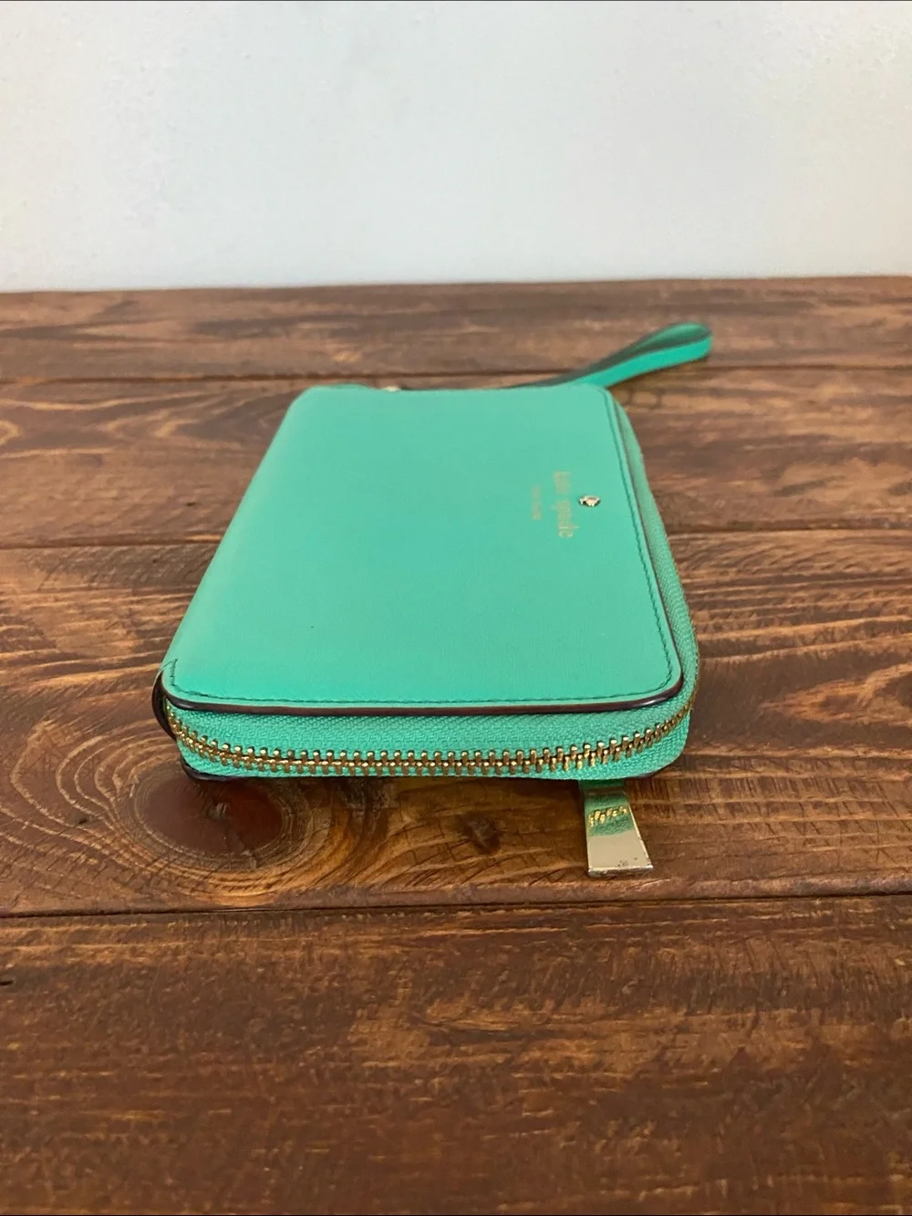 kate spade teal zip-around wristlet with strap